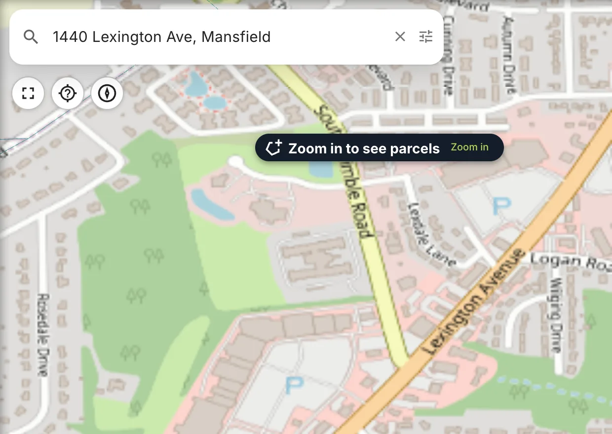After picking an address: the map has zoomed in, and the chip says Zoom in to see parcels