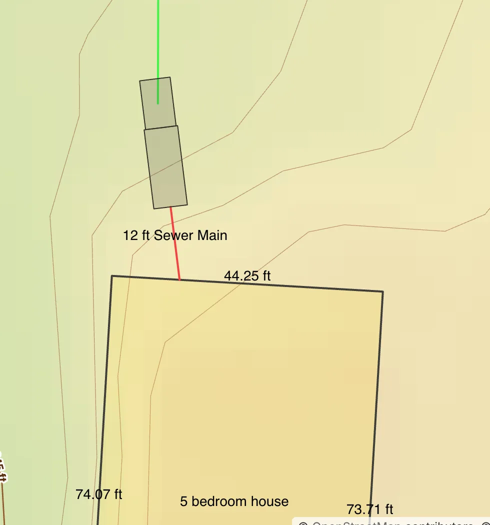 A house, its sewer main and two tanks drawn on the map